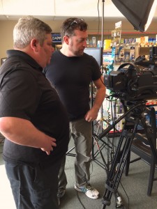 Guerrilla Productions gaffer Dan and cameraman Wil set up a shot inside the Darien Pharmacy location.